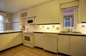 kitchen with white cabinets and appliances