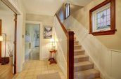 brown and white carpeted staircase photo