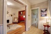 brown wooden table beside doorway