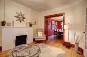 brown sofa chairs beside doorway