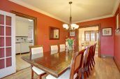 rectangular brown wooden table beside wall