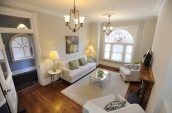 white couch and two table lamps in living room