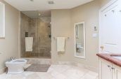 empty bathroom with glass stall and vanity sink