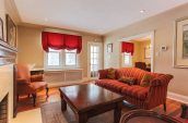 empty living room with brown and red furniture