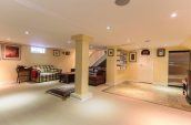 empty basement with light yellow painted wall