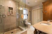 grey bathroom with large stand up shower