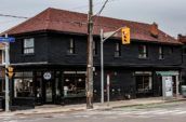 black building with brown roof