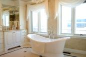 white bathtub near window