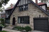 stone wall house with garage