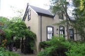 brown and gray house surrounded by trees