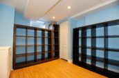 brown wooden rack in room with blue painted walls