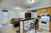 chair near white range stove in kitchen