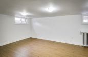 white empty room with hardwood floors