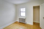 open white wooden door in empty room with window